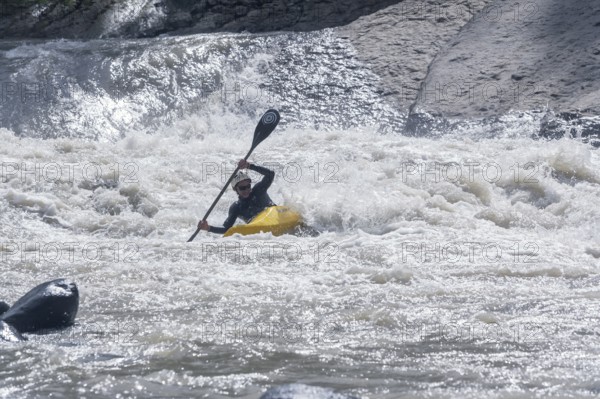 Young woman kayaking in river, Costa Rica, Central America