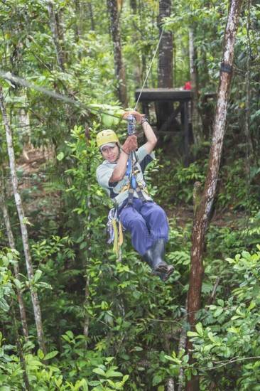 Man on a zipline tour, Costa Rica, Central America