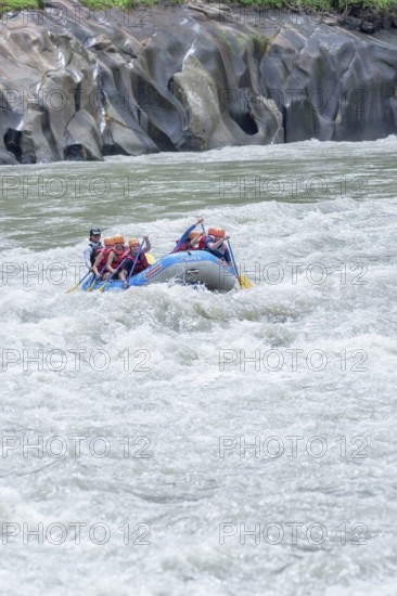 A group of people white water rafting, Costa Rica, Central America