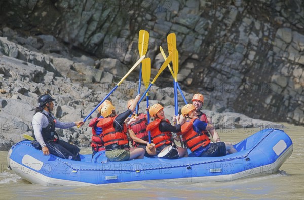 People celebrating white water rafting adventure, Costa Rica, Central America
