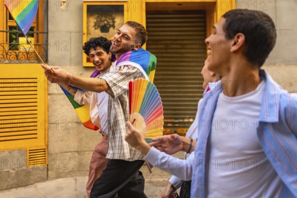 Happy men are walking together on a street during a pride event, holding a small rainbow flag and a rainbow fan, celebrating and expressing their identity with joy