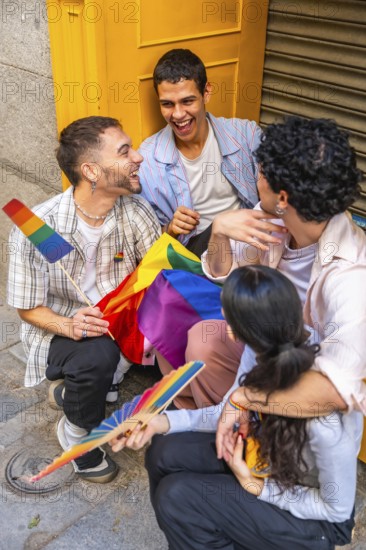 Diverse group of young adult friends enjoying a moment of connection outdoors, holding rainbow flags and expressing joy, representing community, equality, and inclusion