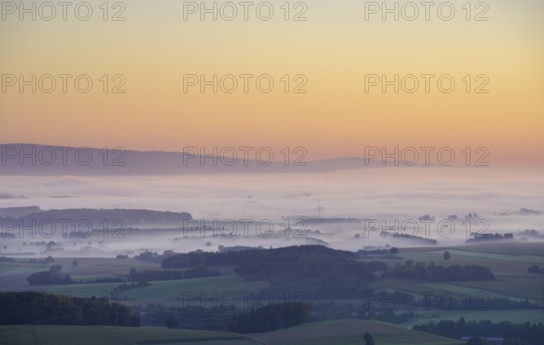Wind turbines rise out of the fog at sunrise, Kirnberg an der Mank, Lower Austria, Austria