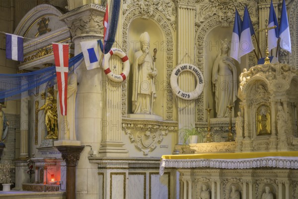 Flags and lifebuoys in the church of Saint Martin, Yport, Département Seine-Maritime, France