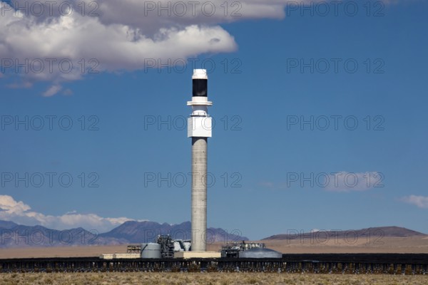 Tonopah, Nevada - The central receiver tower at Crescent Dunes Solar Energy Project in the Nevada desert. Ten thousand mirrors reflect sunlight onto the tower where molten salt is heated to produce steam and generate electricity