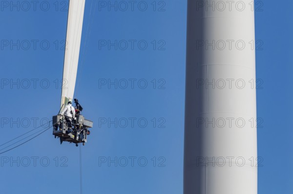 Luverne, Minnesota - Workers repair the cracked blade of a wind turbine