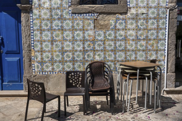Restaurant furniture, for outdoor catering, tables, chairs, stacked, day off, catering closed, old town of Tavira, Algarve, Portugal