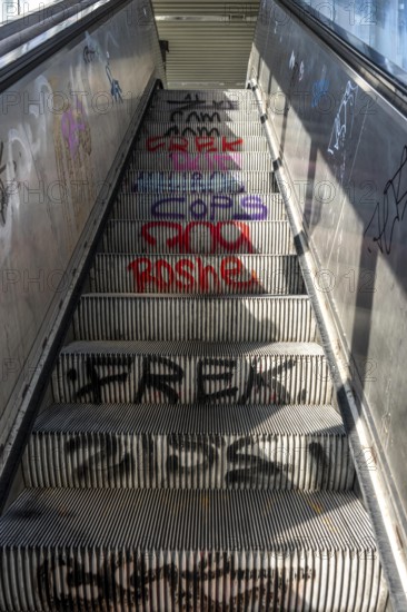 Escalator in a suburban railway station, full of graffiti, Day, Düsseldorf, North Rhine-Westphalia, Germany