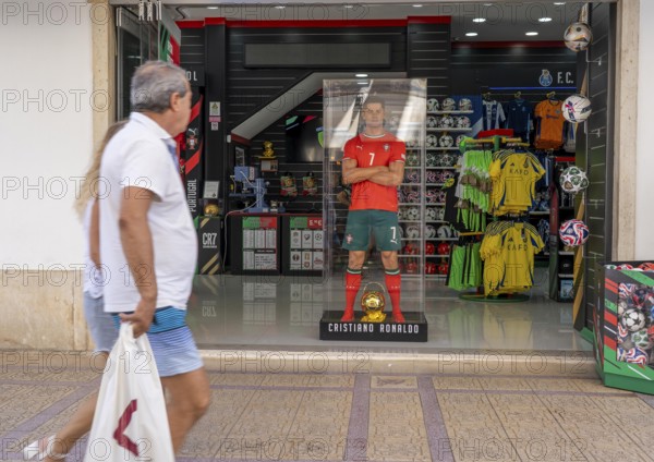 Sports shop, sells merchandise of the Portuguese national football team, various other local football clubs, life-size figure of football star Christiano Ronaldo, CR7, in Vila Real de Santo António, on the border with Spain, Algarve, Portugal
