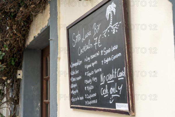 Restaurant, pub, bar, blackboard with offers, note, no credit cards accepted as means of payment, cash only, historic centre of Tavira, Algarve, Portugal