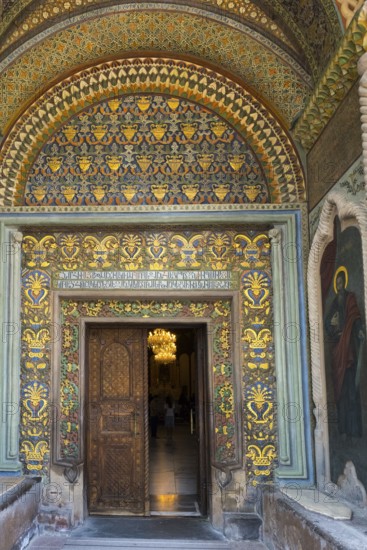 Richly decorated entrance with gold patterns, antique wooden doors and a religious painting, portal of the historically most important Armenian Orthodox cathedral, UNESCO World Heritage Site, Echmiadzin, Ejmiacin, Vagharshapat, Vagarshapat, Valaršapat, Vagharshapat, Armavir Province, Armenia