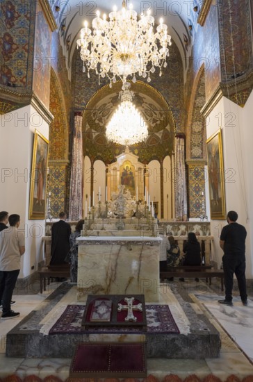 Worshippers gather in the richly decorated church with its large altar and chandeliers, Inside the historic, most important Armenian Orthodox cathedral, UNESCO World Heritage Site, Echmiadzin, Ejmiacin, Vagharshapat, Vagarshapat, Vagarshapat, Valaršapat, Vagharshapat, Armavir Province, Armenia