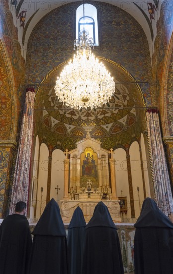 Monks gather in the richly decorated church to pray in front of the altar, Inside the historic, most important Armenian Orthodox cathedral, UNESCO World Heritage Site, Echmiadzin, Echmiadzin, Ejmiacin, Vagharshapat, Vagharshapat, Vagharshapat, Valaršapat, Vagharshapat, Armavir province, Armenia