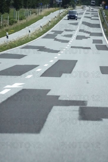 Symbolic image for renovation needs, patched road, Germany