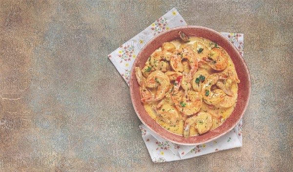 Shrimp in creamy garlic sauce, with spices and herbs