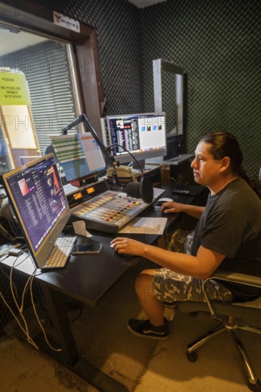 Porcupine, South Dakota - Lucian Little White Man broadcasts on KILI Radio, the voice of the Lakota Nation. The station broadcasts in Lakota and English to the Pine Ridge, Cheyenne River, and Rosebud Indian Reservations. Its finances have been hurt by President Trump's dissolution of the Corporation for Public Broadcasting