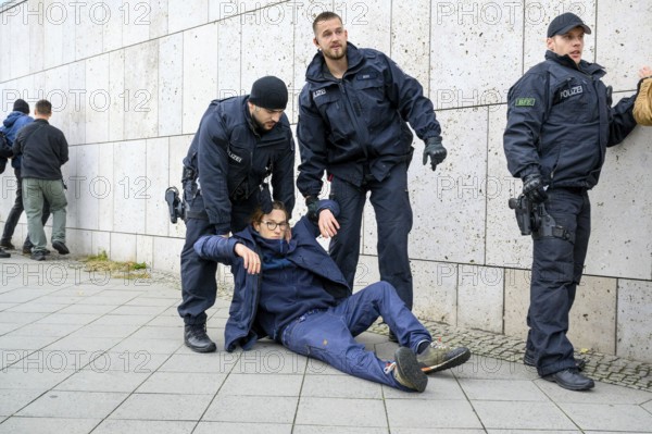 Police arrest activists of the New Generation during an attempt at a performance by the New Generation to fight corruption in front of the Konrad Adenauer House, the federal headquarters of the CDU. Berlin, 06.10.2025