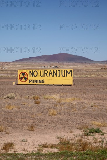 Cameron, Arizona - A sign on the Navajo Nation expresses opposition to Energy Fuels' controversial Pinyon Plain uranium mine, located a few miles from Grand Canyon National Park and inside Baaj Nwaavjo I'tah Kukveni National Monument. Native American tribes fear contamination of ground water and pollution from trucks hauling uranium ore along the 300-mile route to Energy Fuels' White Mesa mill in Utah