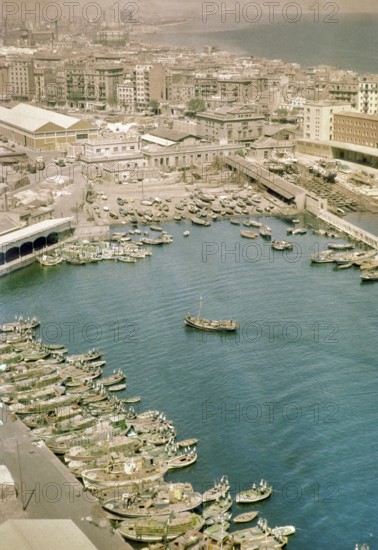 View from cable car of boats and buildings in fishing port, Barceloneta area of Barcelona, Spain, Europe 1965