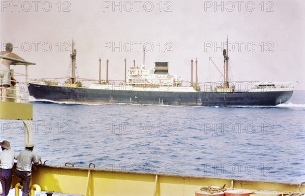 Cargo ship 'Celebes' IMO number 5066853 built 1943 photographed 1965 from onboard another ship subsequently renamed 'Paracas'