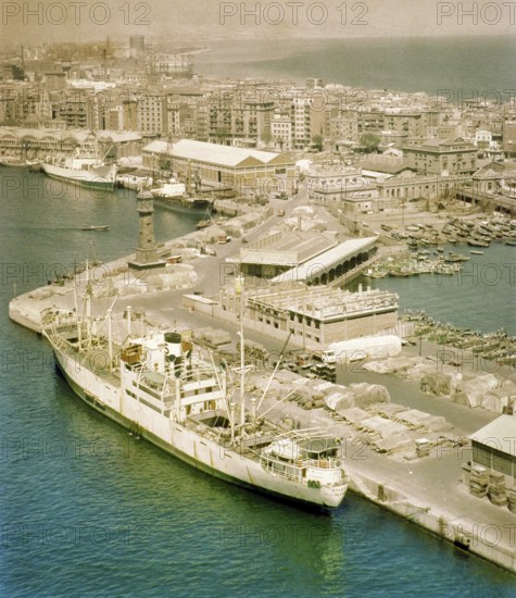View from cable car of cargo ship 'Fylgia' in port, view to Barceloneta area, city of Barcelona, Spain Europe 1965