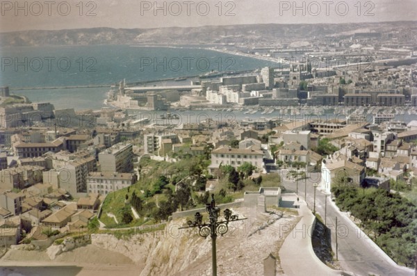 Oblique angle raised view of city centre and port, Vieux Port, Old Port, City of Marseille, France, Europe 1965