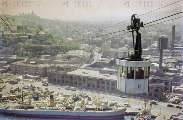 Cable car over port docks and city centre of Barcelona, Spain, Europe 1965