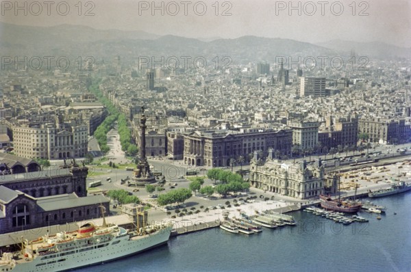 View from cable car to Columbus Monument, Plaça Portal de la Pau, city centre of Barcelona, Spain, Europe 1965
