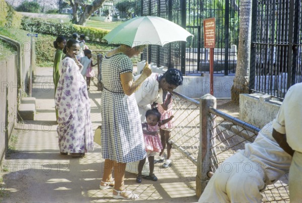 Baby shocked to see white Caucasian woman at zoo, Colombo, Sri Lanka, South Asia, Indian subcontinent, South Asia, 1965