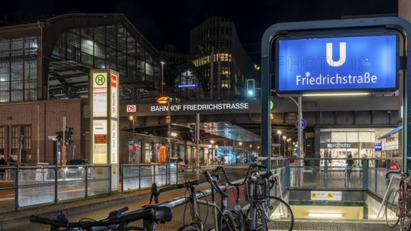 Night photo, long exposure at Friedrichstraße S-Bahn and metro station, in the centre runs the tram line M 12, Berlin, Germany