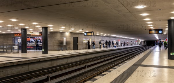 Night photo, long exposure with motion blur, platform at Unter den Linden station, contemporary and modern design, Berlin, Germany