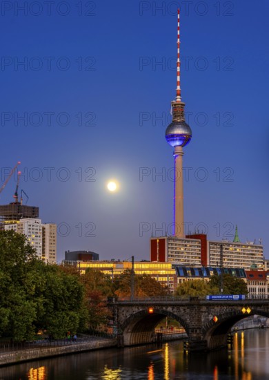 View from the Monbijou Bridge to the television tower, evening light with full moon on the skyline, Berlin, Germany