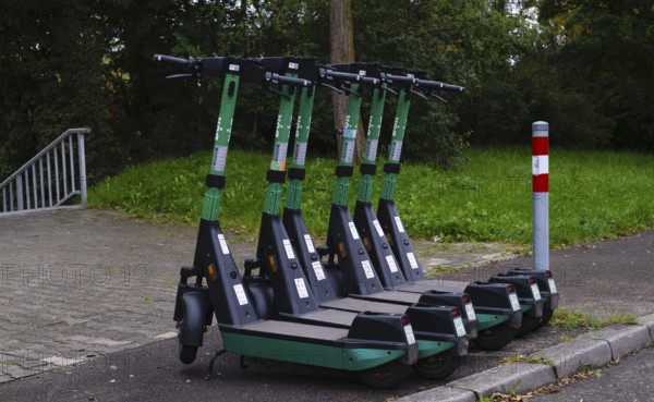 Several e-scooters, electric scooters, scooters parked on the pavement, pavement, in the Bolt bike hire shop, Stuttgart, Baden-Württemberg, Germany