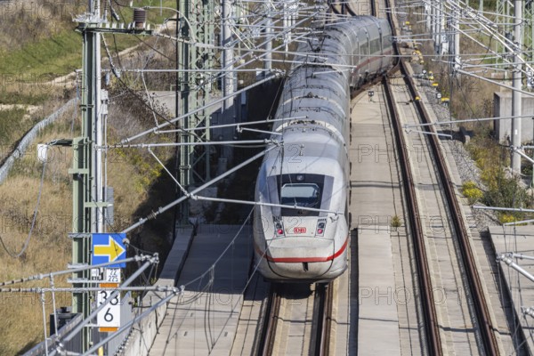 Deutsche Bahn AG high-speed railway line between Stuttgart and Ulm. New railway line with ICE of Deutsche Bahn AG with overhead lines and railway technology. Kirchheim unter Teck, Baden-Württemberg, Germany