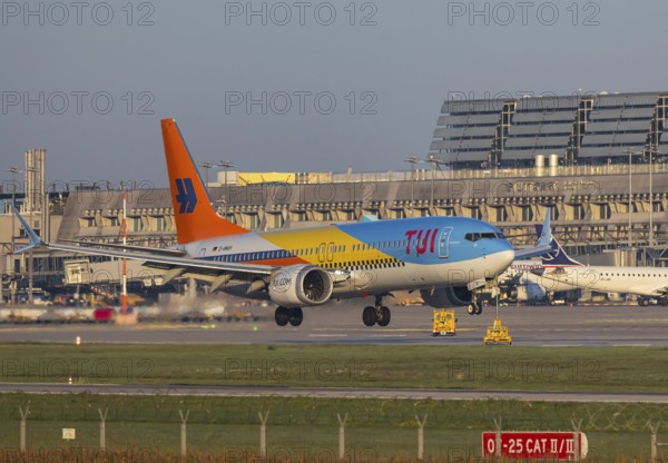 Flight operations at Stuttgart Airport with terminal. Aircraft on landing. Aircraft registration number: D-AMAH, TUIfly, Boeing 737 MAX 8, special livery 50 Years. Stuttgart, Baden-Württemberg, Germany