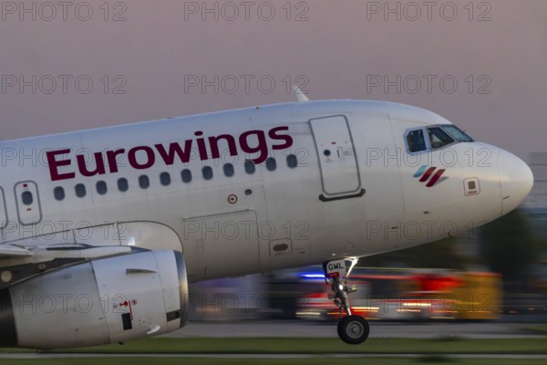 Stuttgart Airport in the early morning. Eurowings aircraft taking off. Close-up. Motion blur. Stuttgart, Baden-Württemberg, Germany