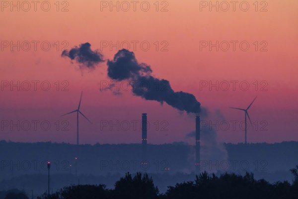 Sunrise on the Filder. Morning atmosphere near Filderstadt. Wind turbines on the Swabian Alb, the chimneys of the Altbach power station. Filderstadt, Baden-Württemberg, Germany
