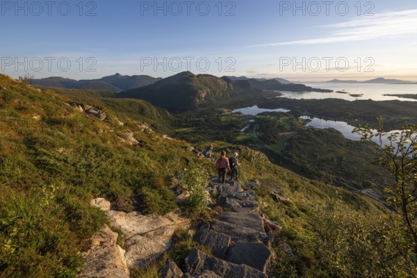 Hikers on the Rørsethornet stone staircase, with 3292 steps one of the longest continuous stone staircases in the world, Sherpatreppe or Midsundtreppe or Midsundtrappene, Rørsethornet hike, Otroya or Otrøya island, Møre og Romsdal, Norway