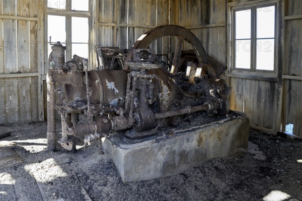 Old engine in a dilapidated building, Pomona, restricted diamond area, near Lüderitz, Karas region, Namibia