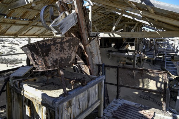 Drum sieve for sieving diamonds in a derelict building, Pomona, restricted diamond area, near Lüderitz, Karas region, Namibia