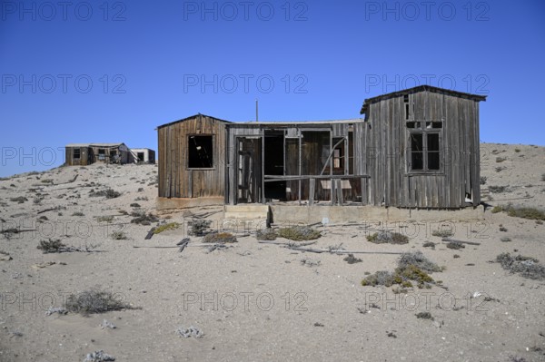 Dilapidated building in the desert sand, Pomona, restricted diamond area, near Lüderitz, Karas region, Namibia