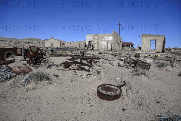 Ruined buildings in the desert sand, Pomona, restricted diamond area, near Lüderitz, Karas region, Namibia