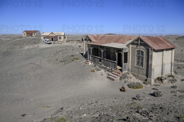 Ruined buildings in the desert sand, Pomona, restricted diamond area, near Lüderitz, Karas region, Namibia