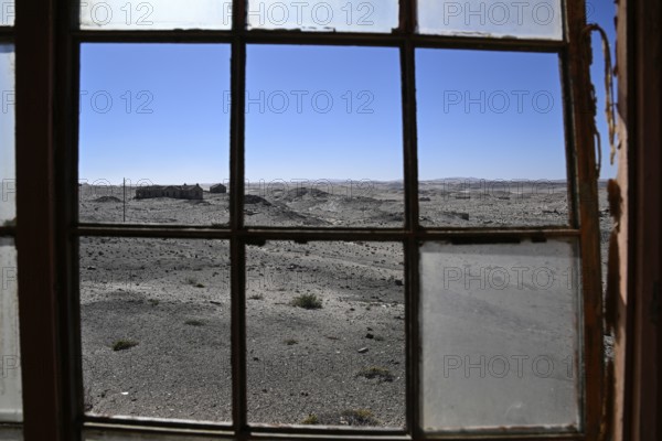 View from a dilapidated building into the desert, Pomona, restricted diamond area, near Lüderitz, Karas region, Namibia