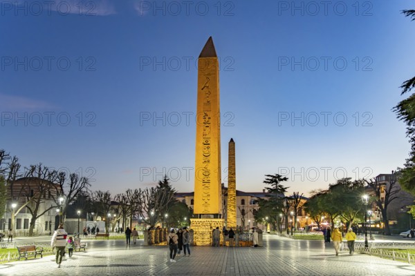 The Ancient Egyptian Obelisk of Theodosius or Obelisk of Istanbul and the Column of Constantine or Masonry Obelisk on the Hippodrome in Istanbul at dusk, Turkey