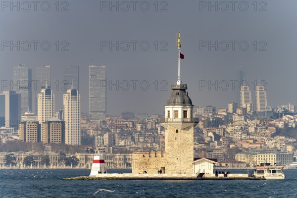 The Maiden Tower lighthouse, Leander Tower or Maiden Tower in front of the skyline of Istanbul, Turkey