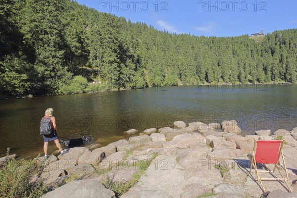 Lake landscape and empty deckchairs with tourist on the lakeshore, mountain, forest, Karsee, mountain lake, mountain station, nature, Mummelsee, Honrisgrinde, Black Forest High Road, Northern Black Forest, Black Forest, Baden-Württemberg, Germany