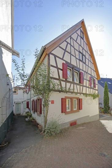 Half-timbered house with red shutters, Höllgasse, Wiesloch, Baden-Württemberg, Germany