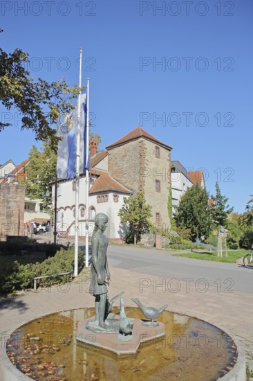 Gänselieselbrunnen by Helmut Waldherr 1981 and local history museum with historical fortified defence tower Dörndl, modern art, bronze sculpture, female figure with goose figures, fountain, Gänseliesel, fountain, Röhrbuckel, Wiesloch, Baden-Württemberg, Germany