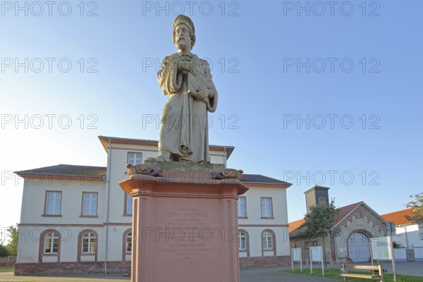 Schöffer monument at the town hall, Peter Schöffer first bookseller, publisher, entrepreneur of book printing, Schöffer monument, Schöfferplatz, Gernsheim, Hesse, Germany